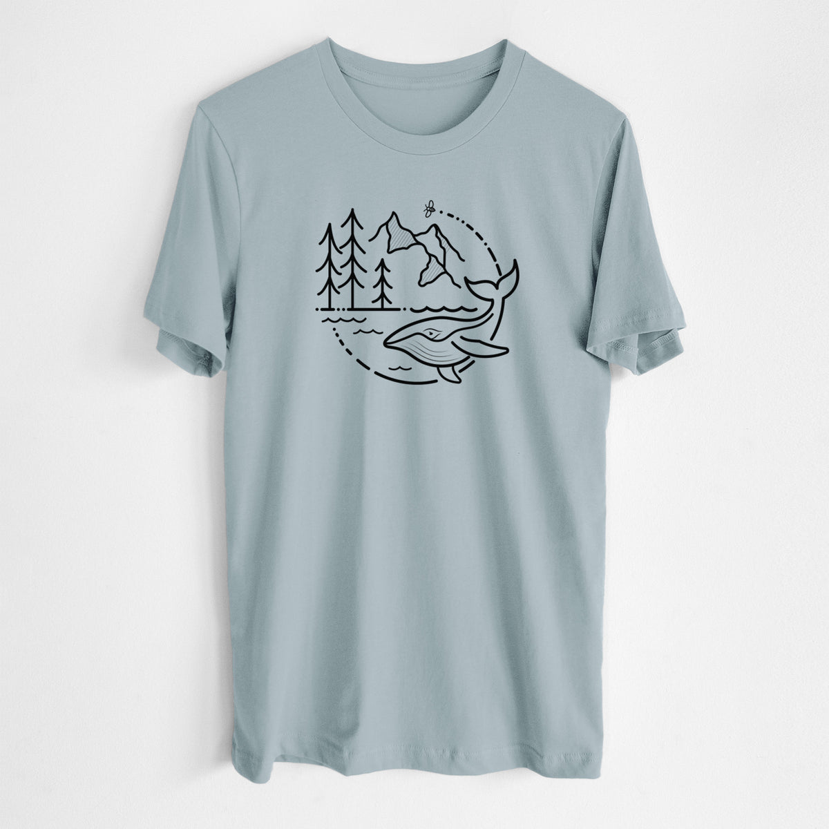 Vintage denim lightweight cotton t-shirt laid flat, printed with a black line art circle connecting a mountain range, pine trees, a bee and a whale swimming in ocean waves.