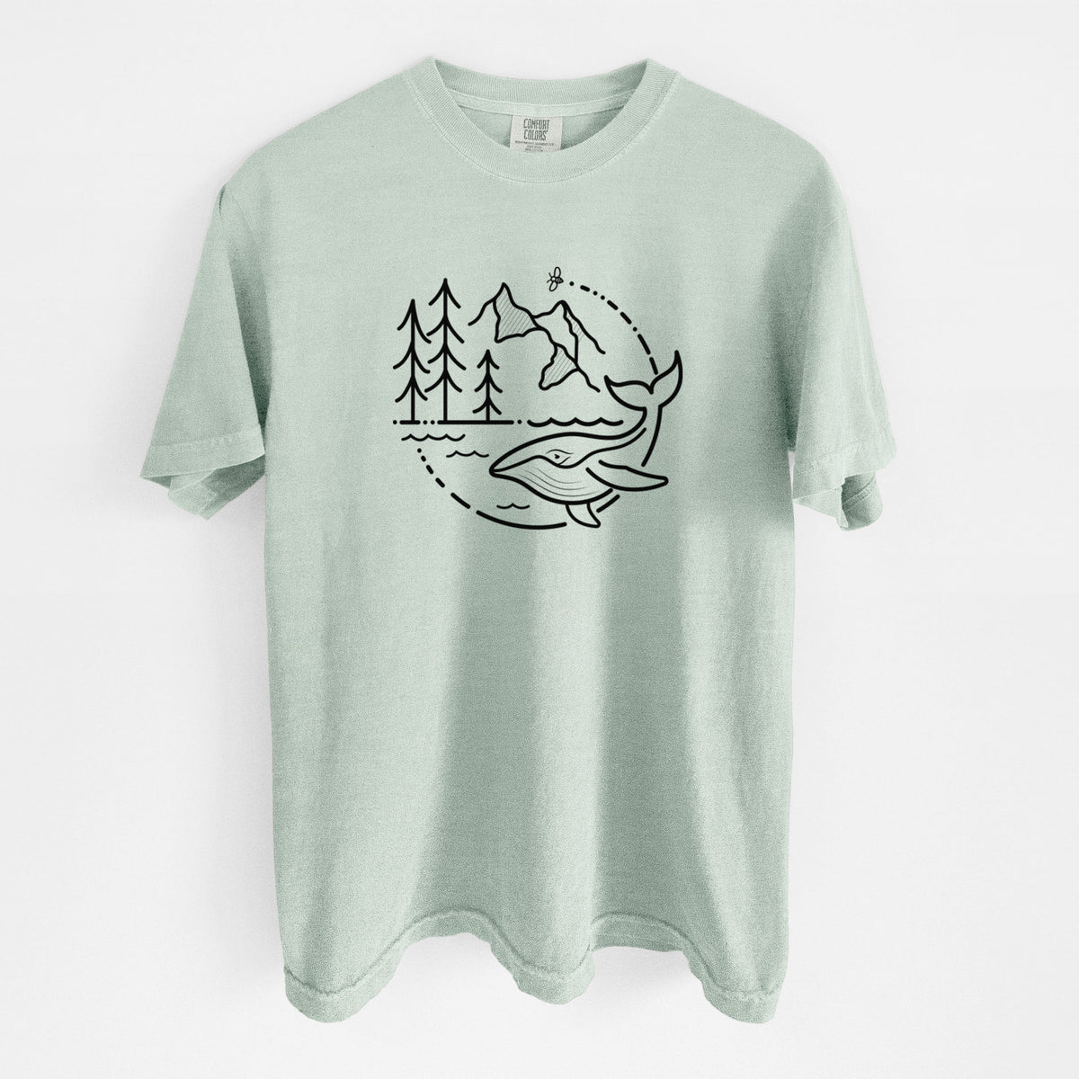 Bay green Comfort Colors t-shirt laid flat, printed with a black line art circle connecting a mountain range, pine trees, a bee and a whale swimming in ocean waves.