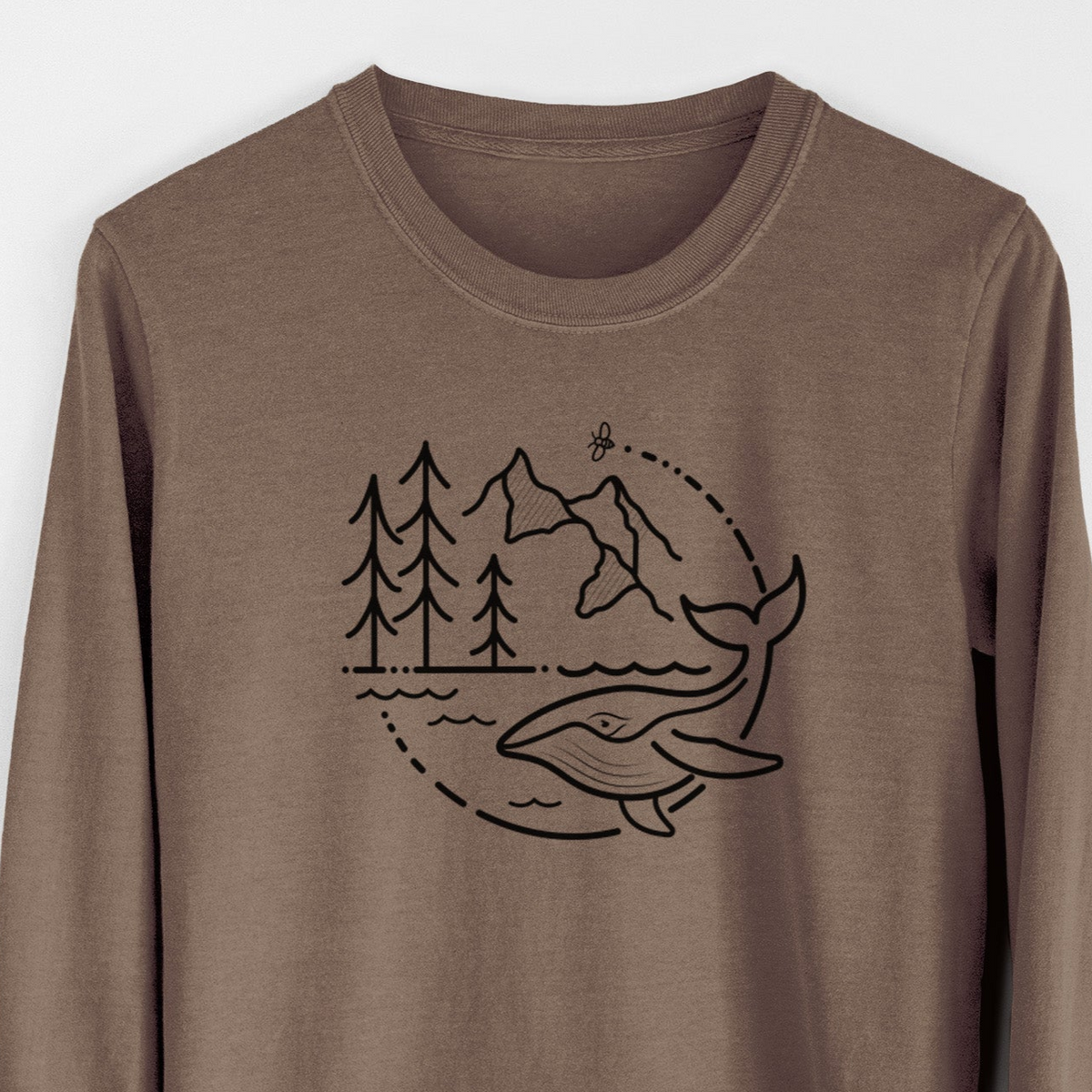 Espresso brown Comfort Colors long sleeve shirt laid flat, printed with a black line art circle connecting a mountain range, pine trees, a bee and a whale swimming in ocean waves.