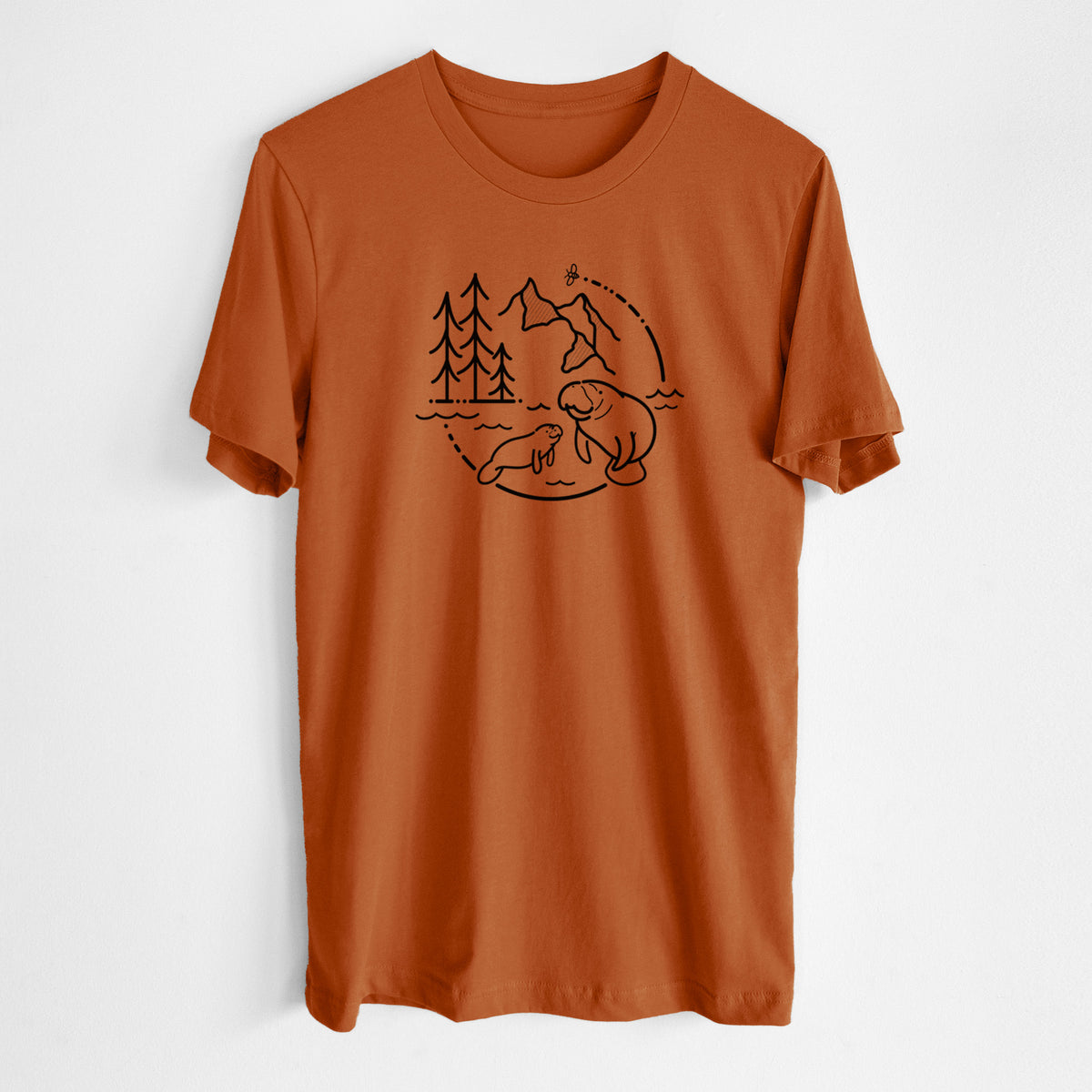 Autumn lightweight cotton t-shirt laid flat, printed with a black line art circle connecting pine trees, mountains, a bee and two manatees swimming in water.