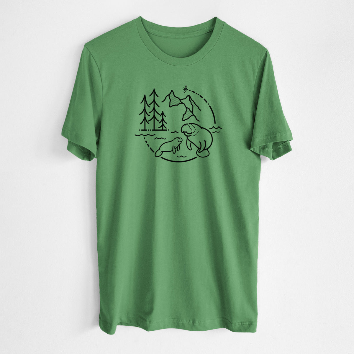 Leaf green lightweight cotton t-shirt laid flat, printed with a black line art circle connecting pine trees, mountains, a bee and two manatees swimming in water.
