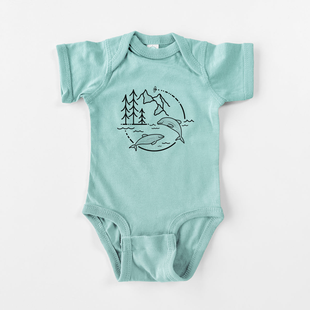 Saltwater baby bodysuit laid flat, printed with a black line art circle connecting pine trees, mountains, a bee and two Maui dolphins leaping from the waves.