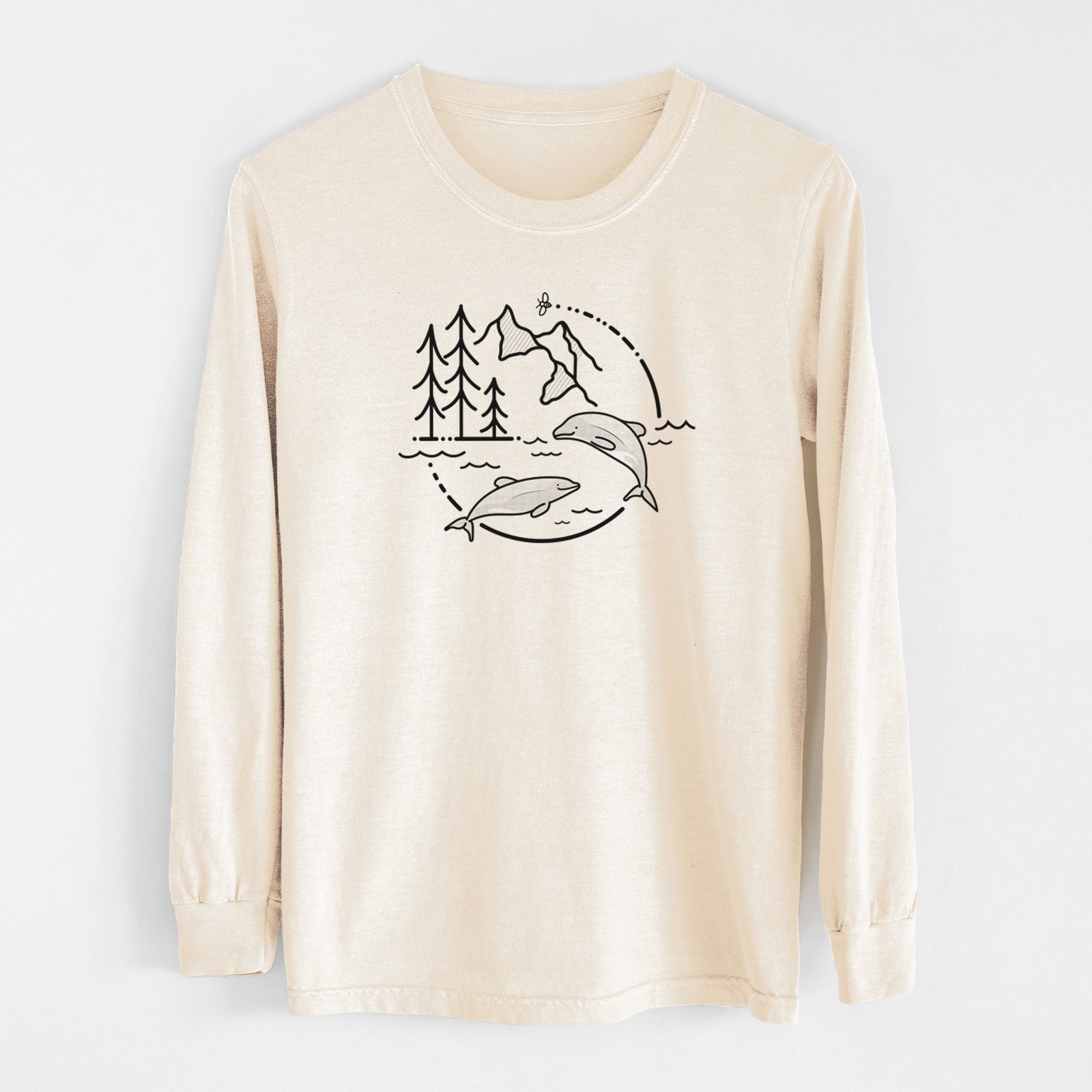 Ivory Comfort Colors long sleeve shirt laid flat, printed with a black line art circle connecting pine trees, mountains, a bee and two Maui dolphins leaping from the waves.