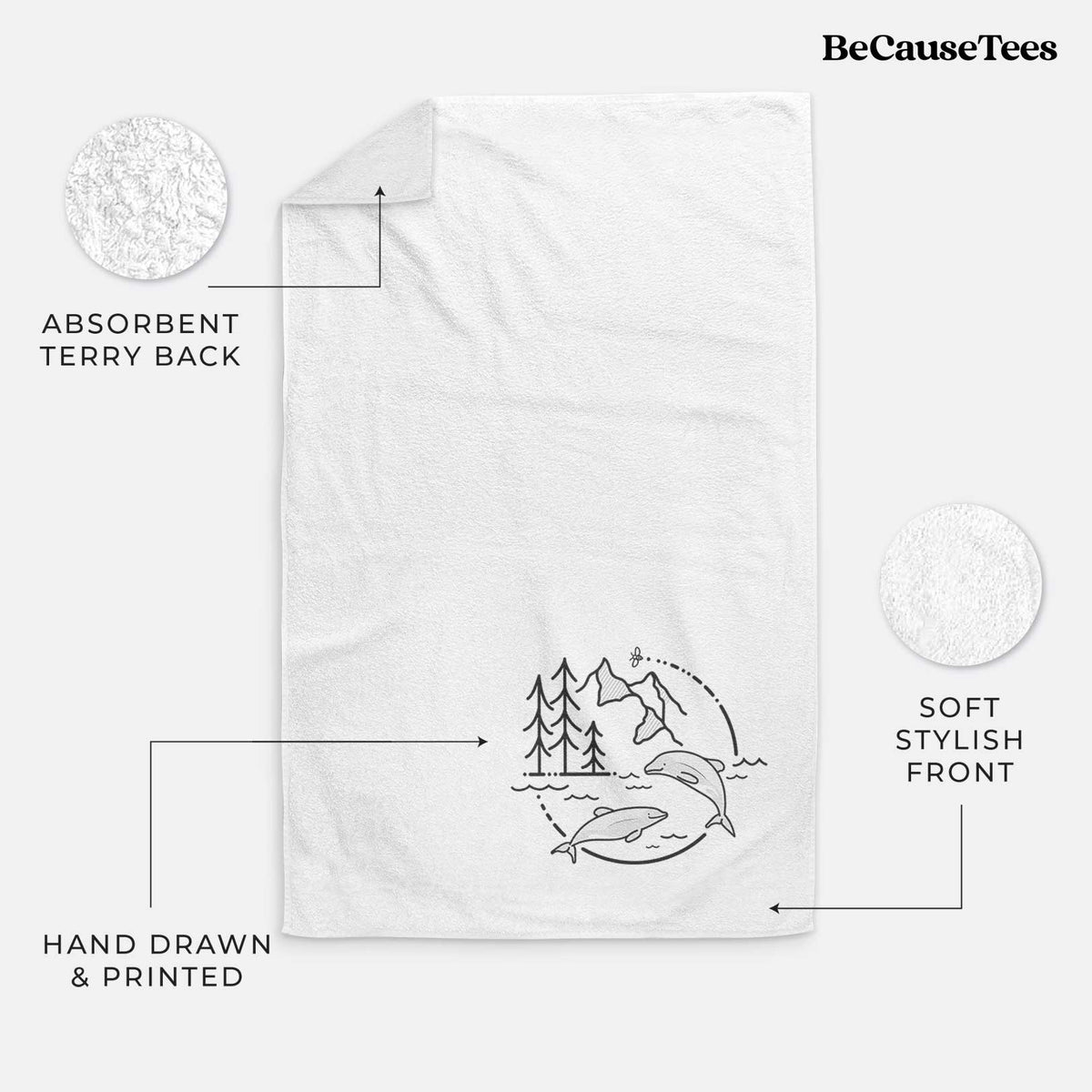 White hand towel printed with a black line art circle connecting pine trees, mountains, a bee and two Maui dolphins leaping from the waves.