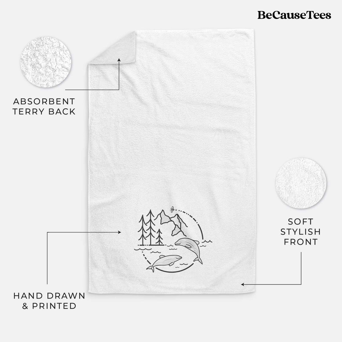 White hand towel printed with a black line art circle connecting pine trees, mountains, a bee and two Maui dolphins leaping from the waves.