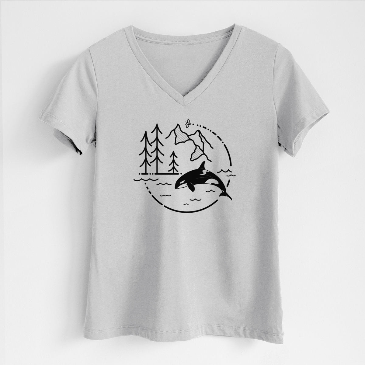 Lunar grey women's relaxed fit cotton V-neck t-shirt laid flat, printed with a black line art circle connecting pine trees, mountains, a bee and an orca leaping from ocean waves.