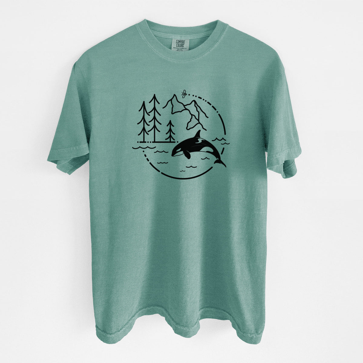 Reef green Comfort Colors t-shirt laid flat, printed with a black line art circle connecting pine trees, mountains, a bee and an orca leaping from ocean waves.