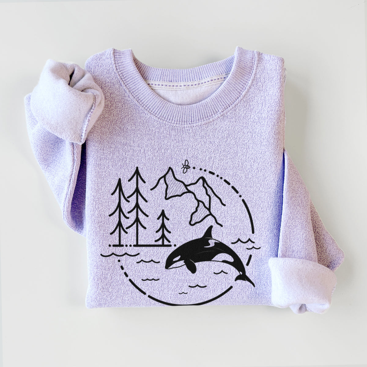 Ice purple knit sweatshirt printed with a black line art circle connecting pine trees, mountains, a bee and an orca leaping from ocean waves, styled flat.