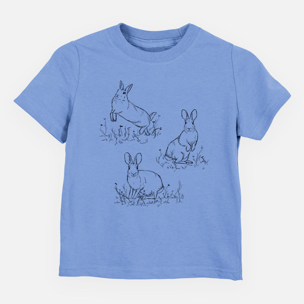 Carolina blue toddler t-shirt laid flat, printed with a black ink illustration of three cottontail rabbits among grass and flowers.