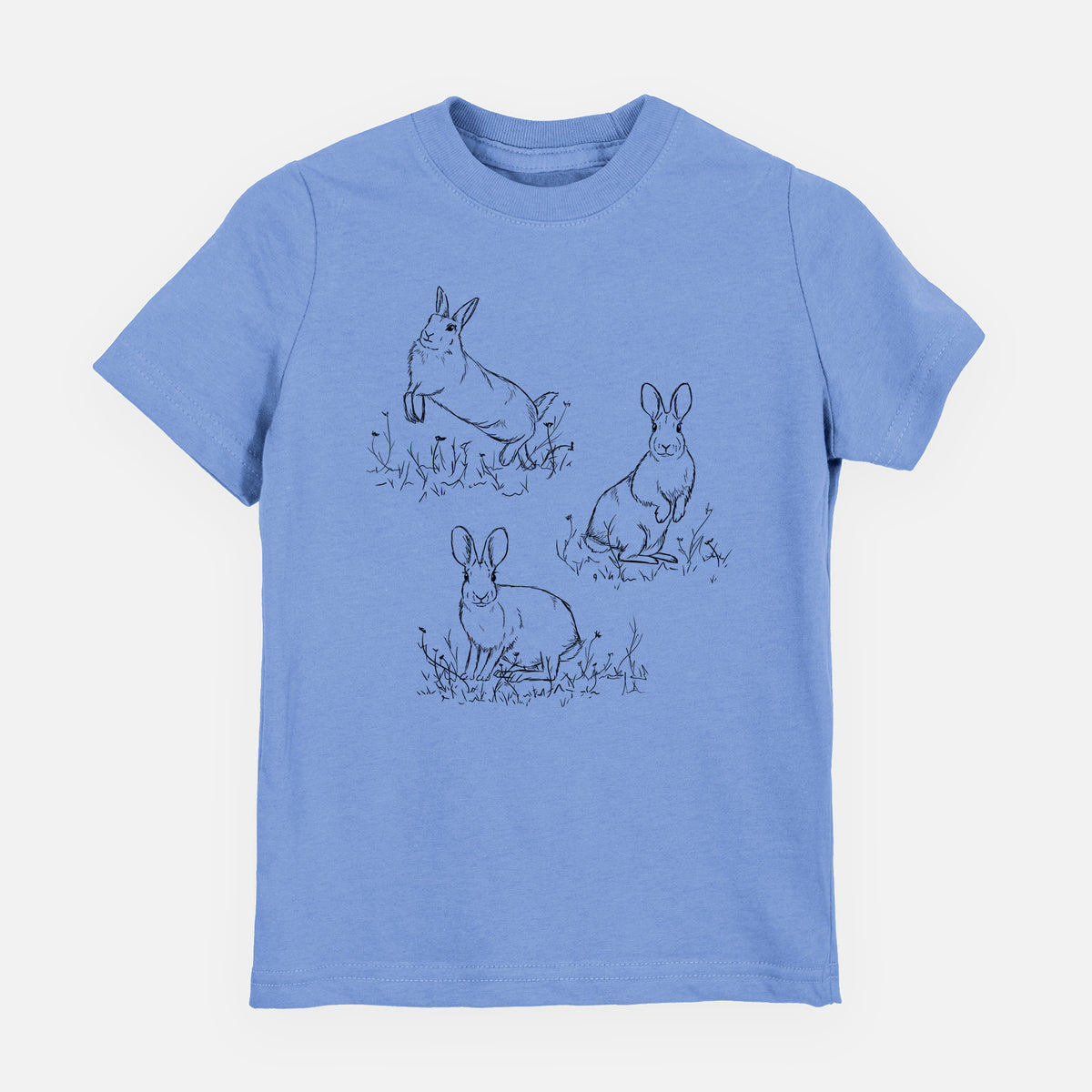 Carolina blue youth t-shirt laid flat, printed with a black ink illustration of three cottontail rabbits among grass and flowers.