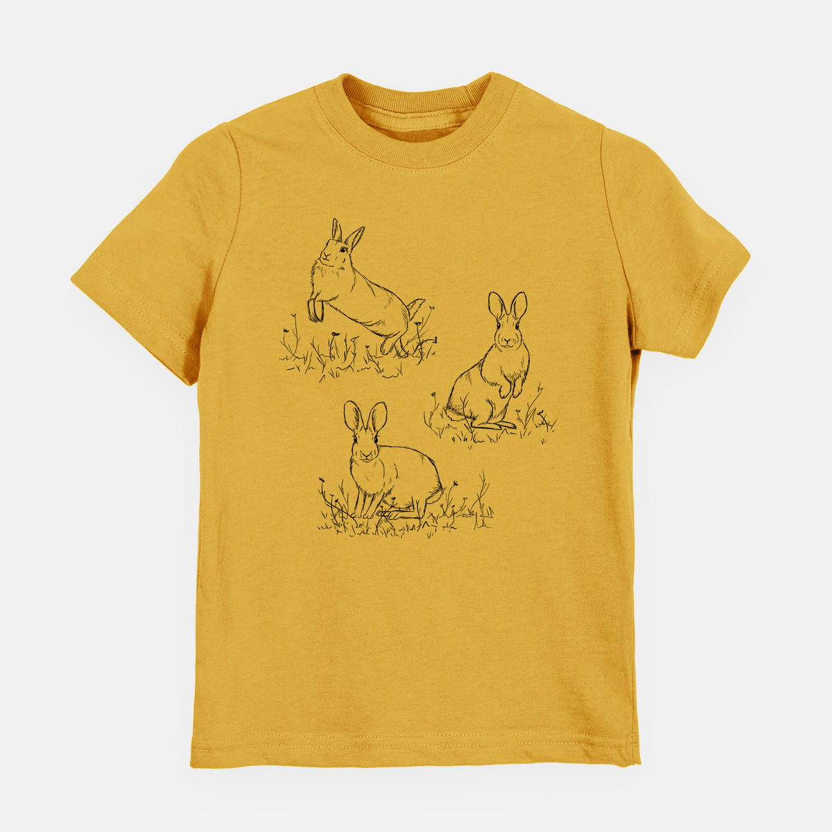 Honeycomb yellow youth t-shirt laid flat, printed with a black ink illustration of three cottontail rabbits among grass and flowers.