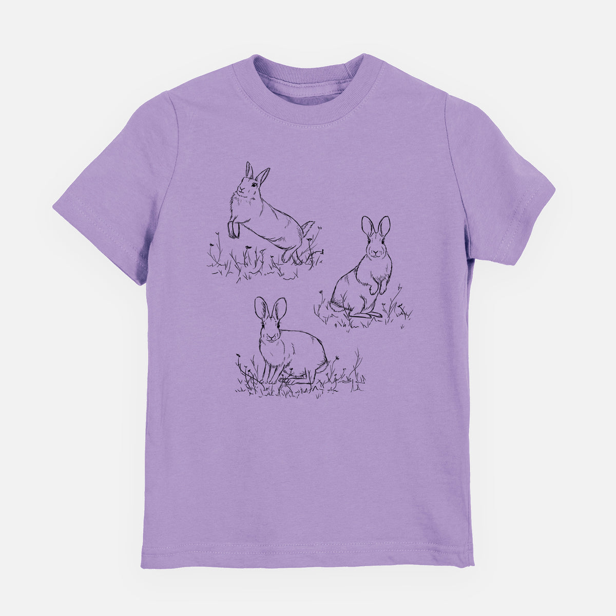 Lavender youth t-shirt laid flat, printed with a black ink illustration of three cottontail rabbits among grass and flowers.