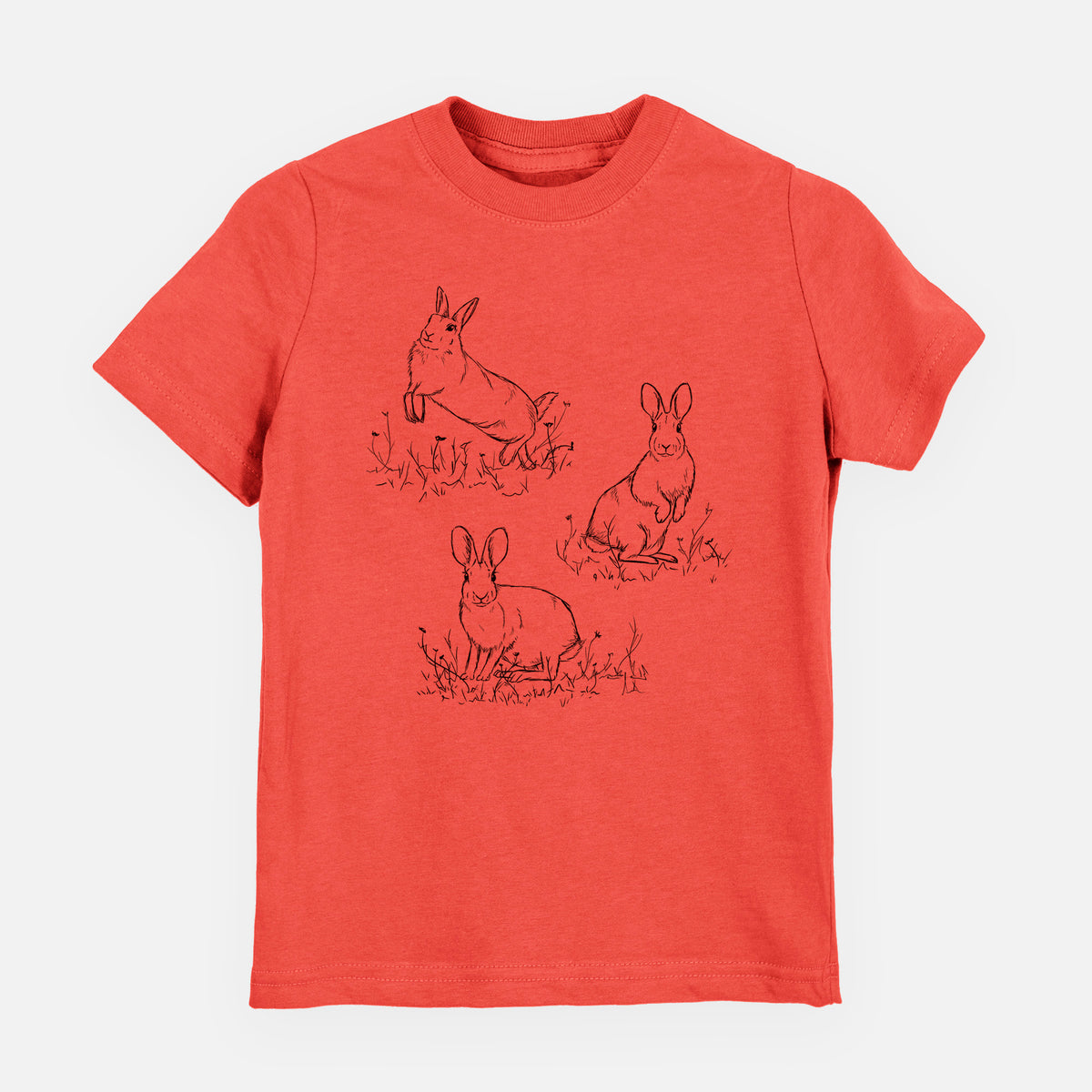 Passionfruit pink youth t-shirt laid flat, printed with a black ink illustration of three cottontail rabbits among grass and flowers.