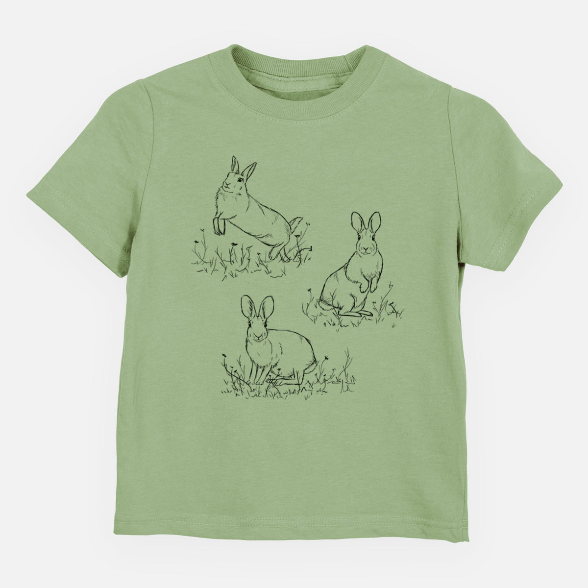 Sage green toddler t-shirt laid flat, printed with a black ink illustration of three cottontail rabbits among grass and flowers.