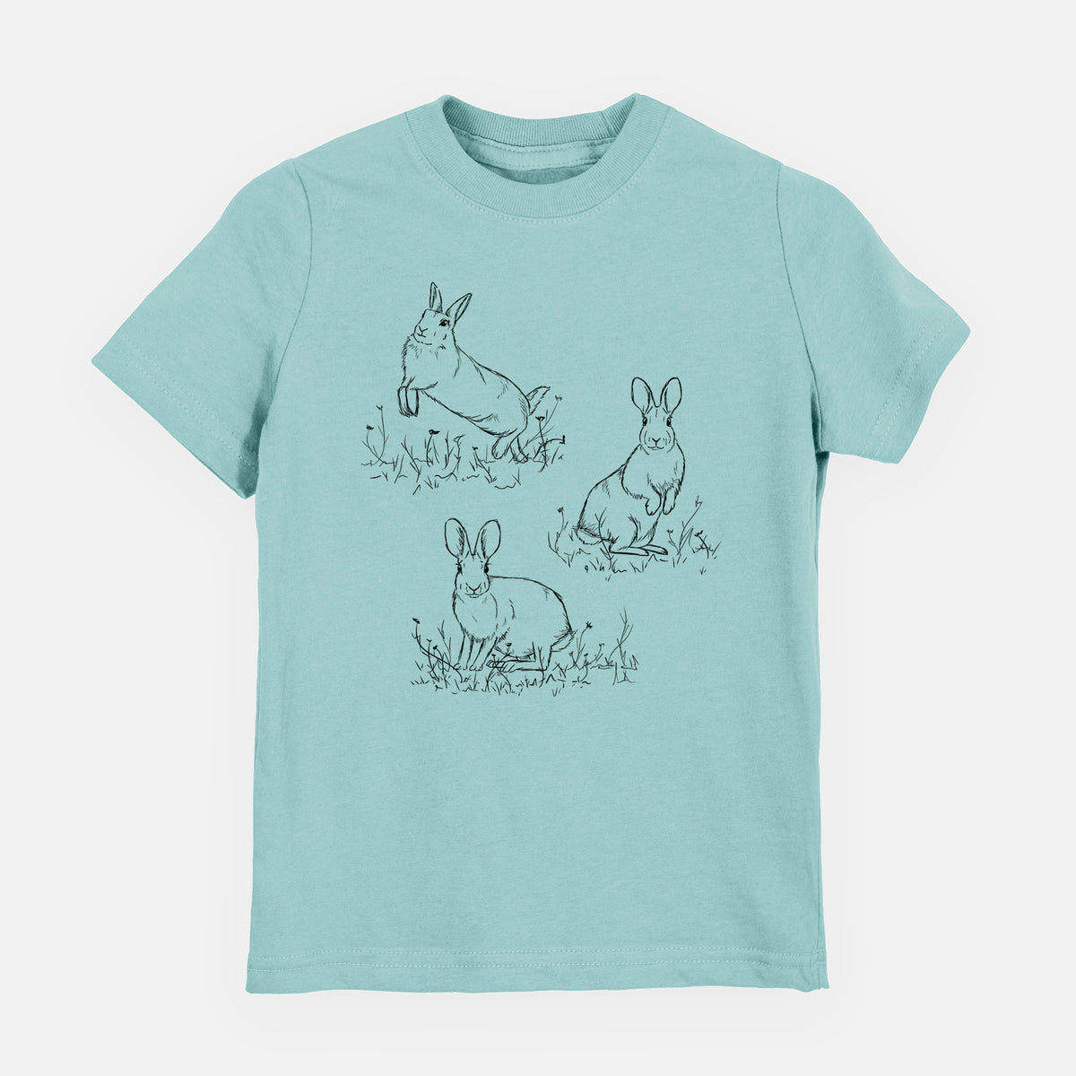 Saltwater youth t-shirt laid flat, printed with a black ink illustration of three cottontail rabbits among grass and flowers.