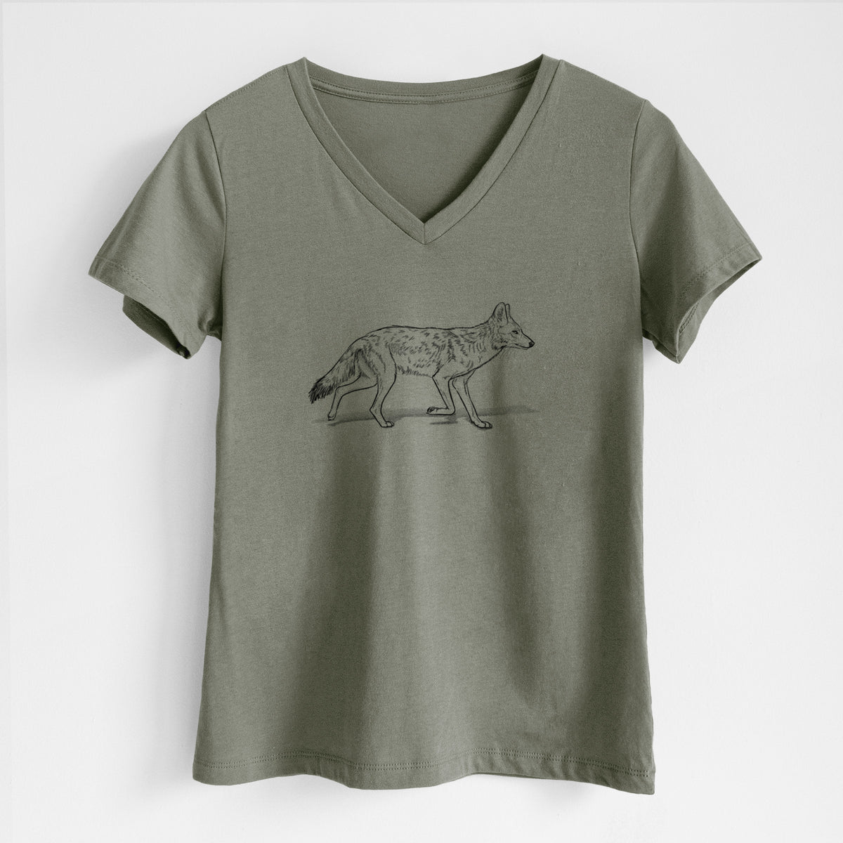 Military green women's relaxed fit cotton V-neck t-shirt laid flat, printed with a black ink illustration of a coyote trotting.