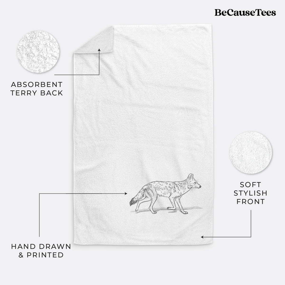 White hand towel printed with a black ink illustration of a coyote trotting.