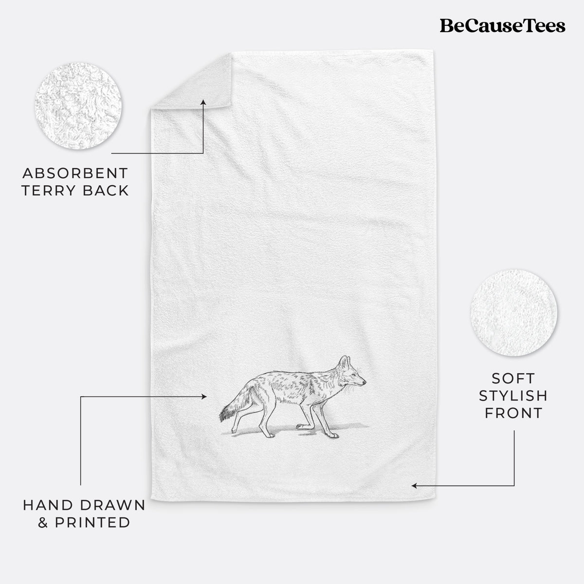 White hand towel printed with a black ink illustration of a coyote trotting.