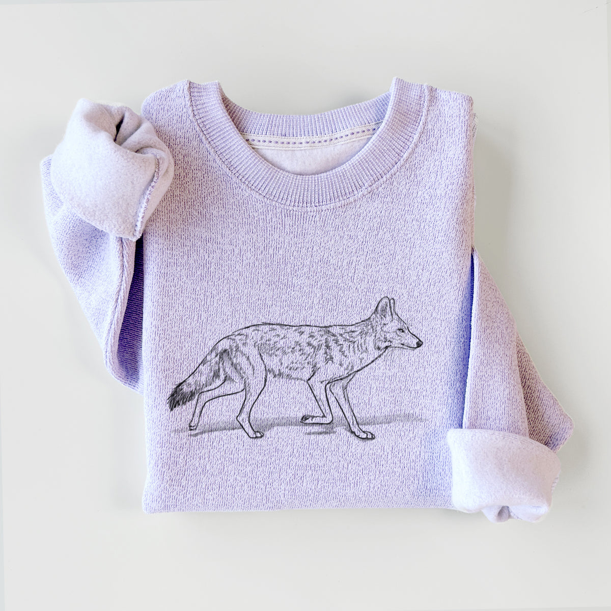 Ice purple knit sweatshirt printed with a black ink illustration of a coyote trotting, styled flat.
