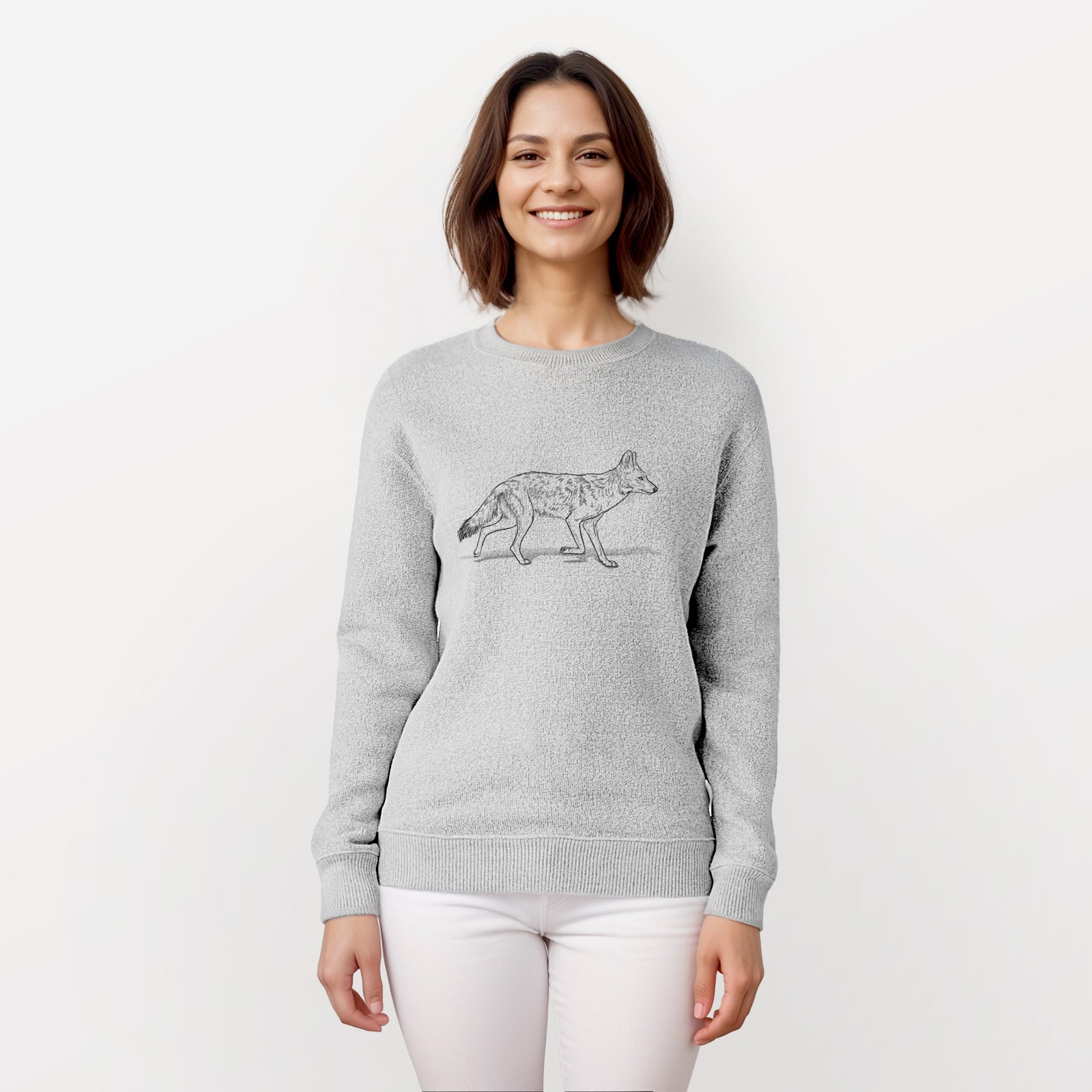Salt and pepper knit sweatshirt laid flat, printed with a black ink illustration of a coyote trotting.