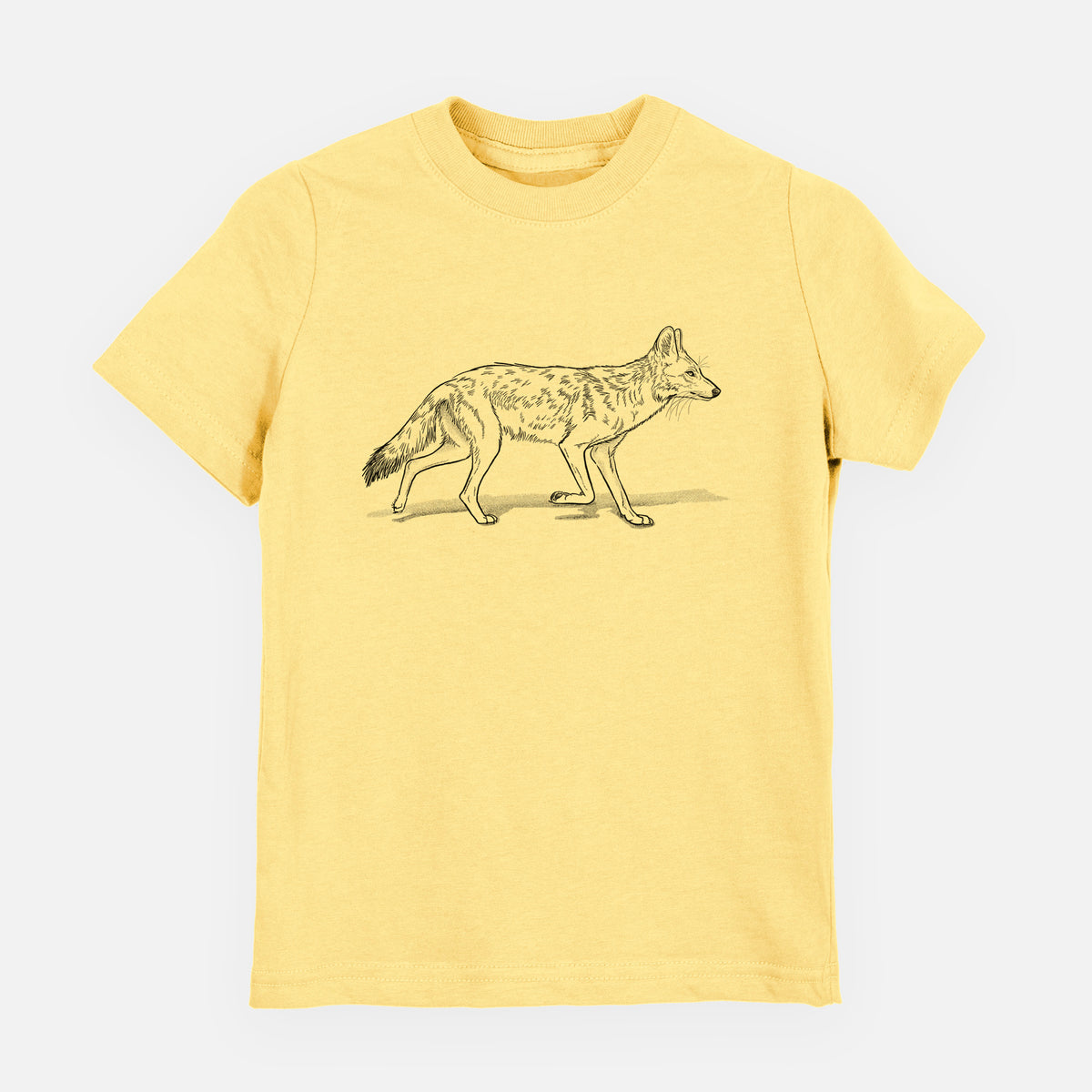Butter yellow youth t-shirt laid flat, printed with a black ink illustration of a coyote trotting.