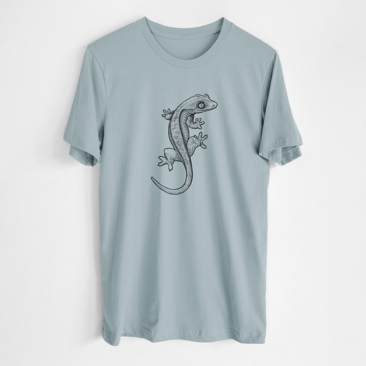 Vintage denim lightweight cotton t-shirt laid flat, printed with a detailed black ink illustration of a crested gecko climbing.