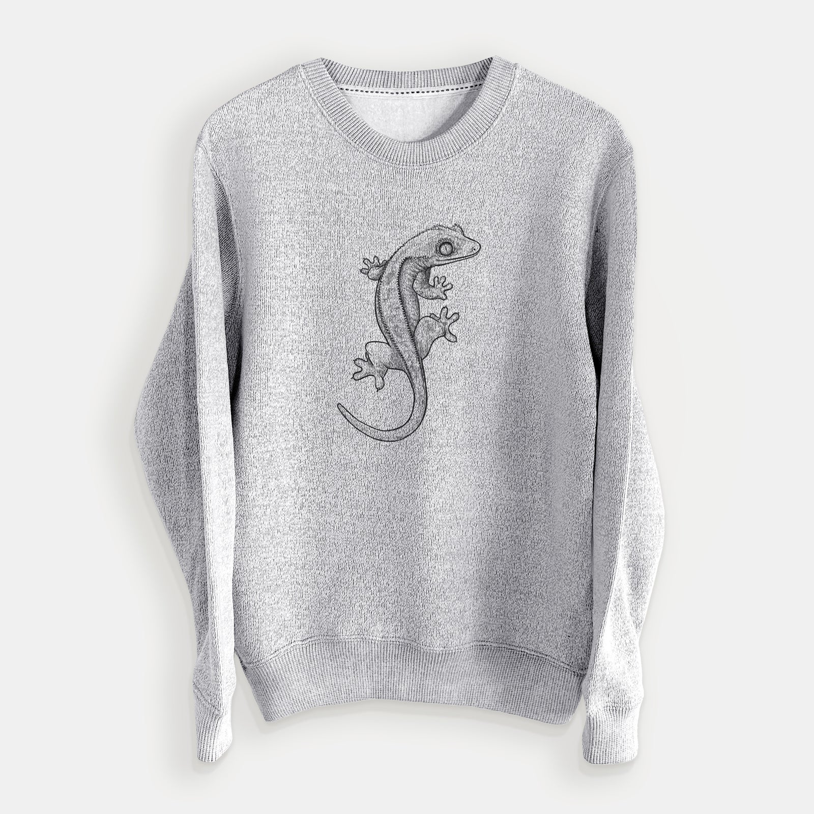 Salt and pepper knit sweatshirt laid flat, printed with a detailed black ink illustration of a crested gecko climbing.