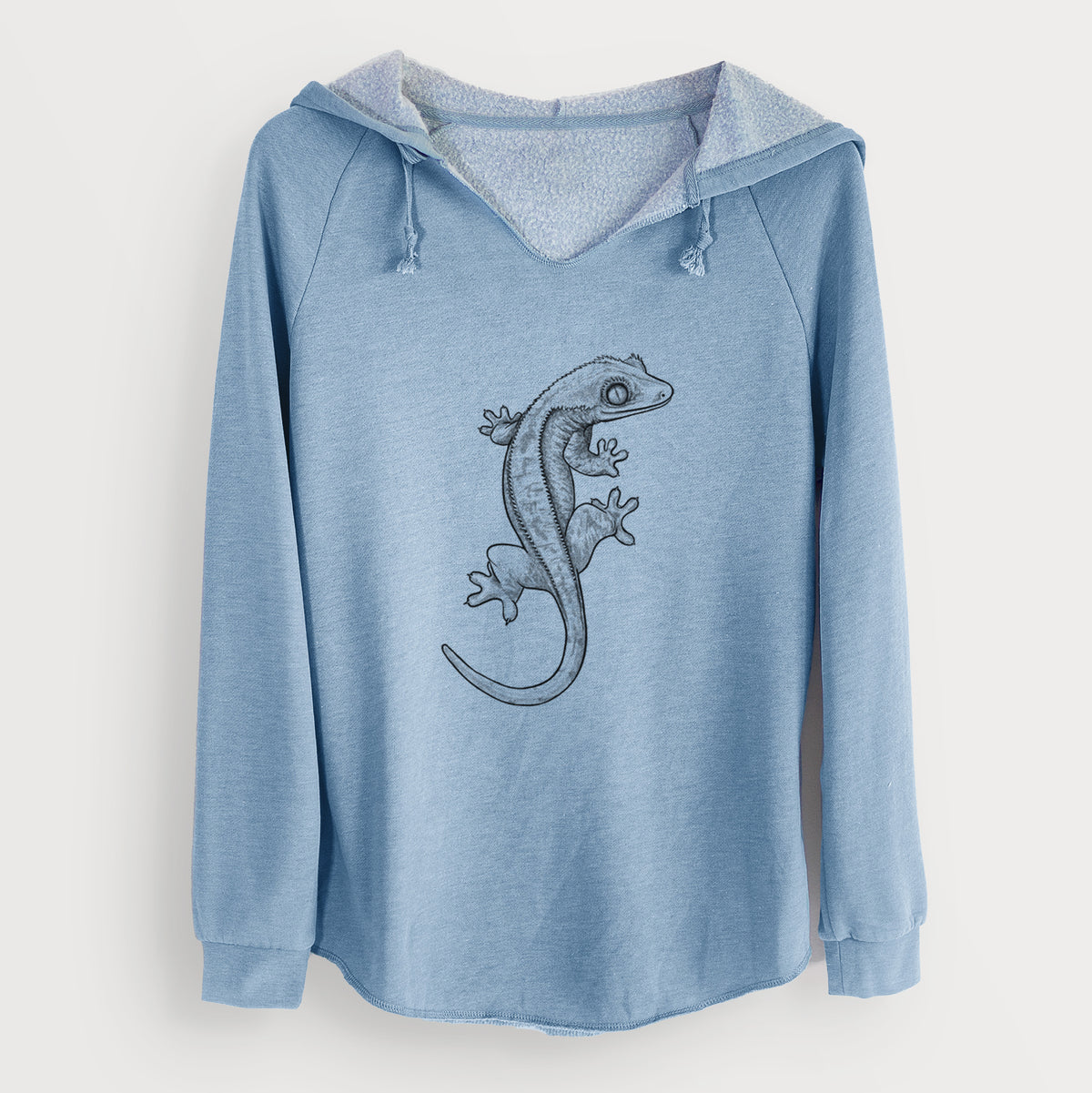 Misty blue women's Cali Wave hooded sweatshirt laid flat, printed with a detailed black ink illustration of a crested gecko climbing.