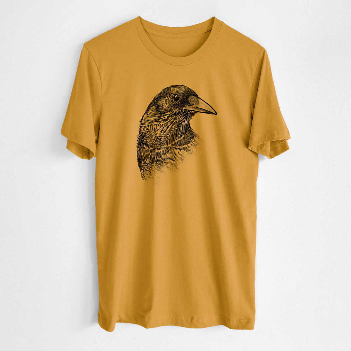 Honeycomb yellow lightweight cotton t-shirt laid flat, printed with a detailed black ink portrait of a crow's head in profile.