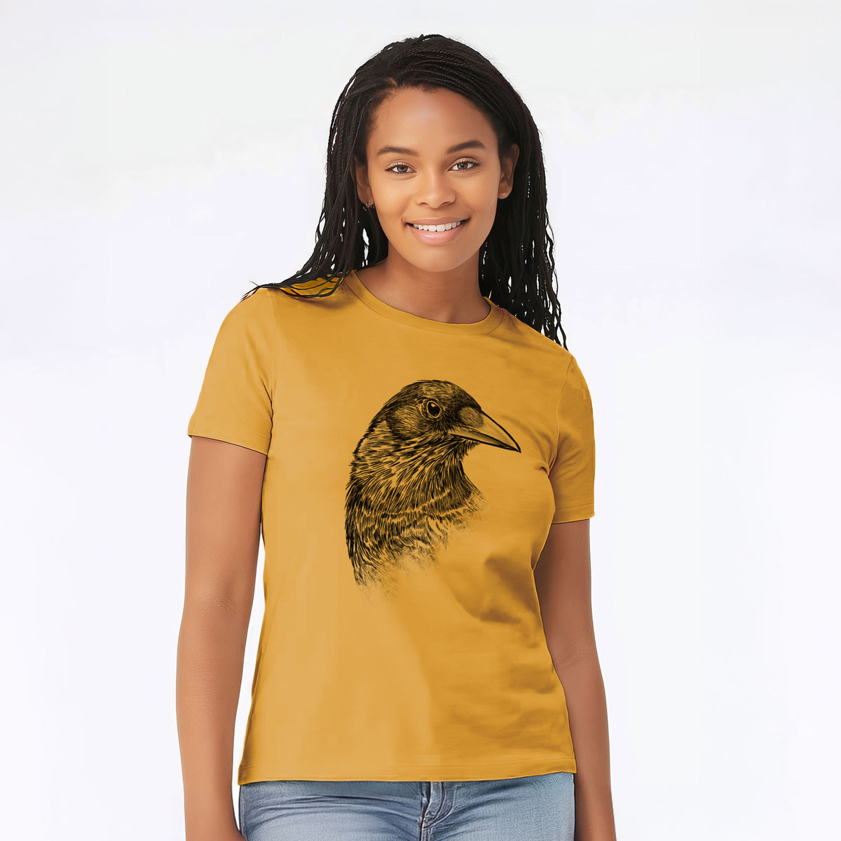 Woman wearing a mustard yellow women's relaxed fit cotton t-shirt printed with a detailed black ink portrait of a crow's head in profile.