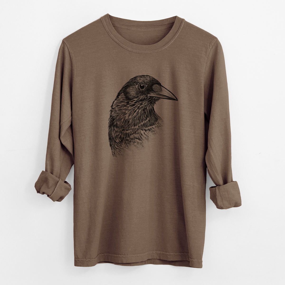Espresso brown Comfort Colors long sleeve shirt laid flat with the cuffs rolled, printed with a detailed black ink portrait of a crow's head in profile.