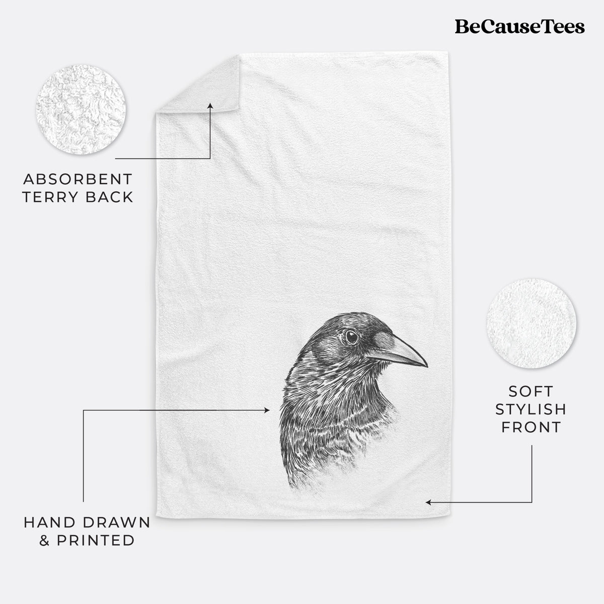 White hand towel printed with a detailed black ink portrait of a crow's head in profile.