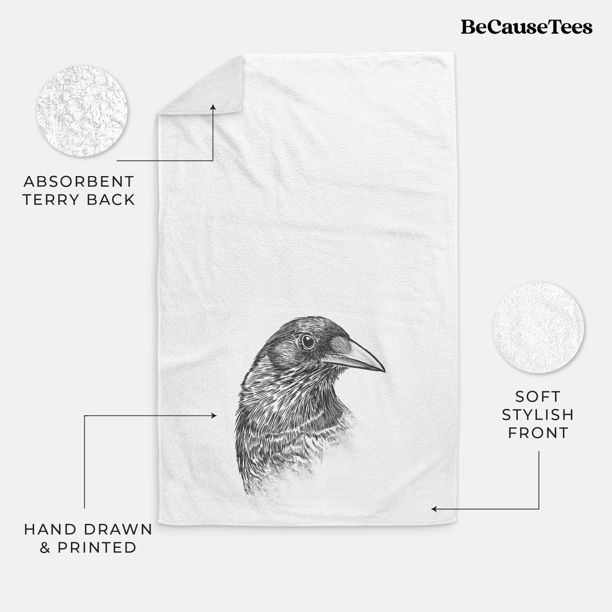 White hand towel printed with a detailed black ink portrait of a crow's head in profile.