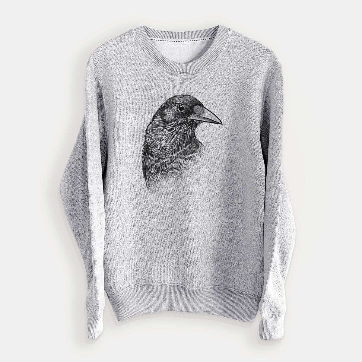 Salt and pepper knit sweatshirt laid flat, printed with a detailed black ink portrait of a crow's head in profile.