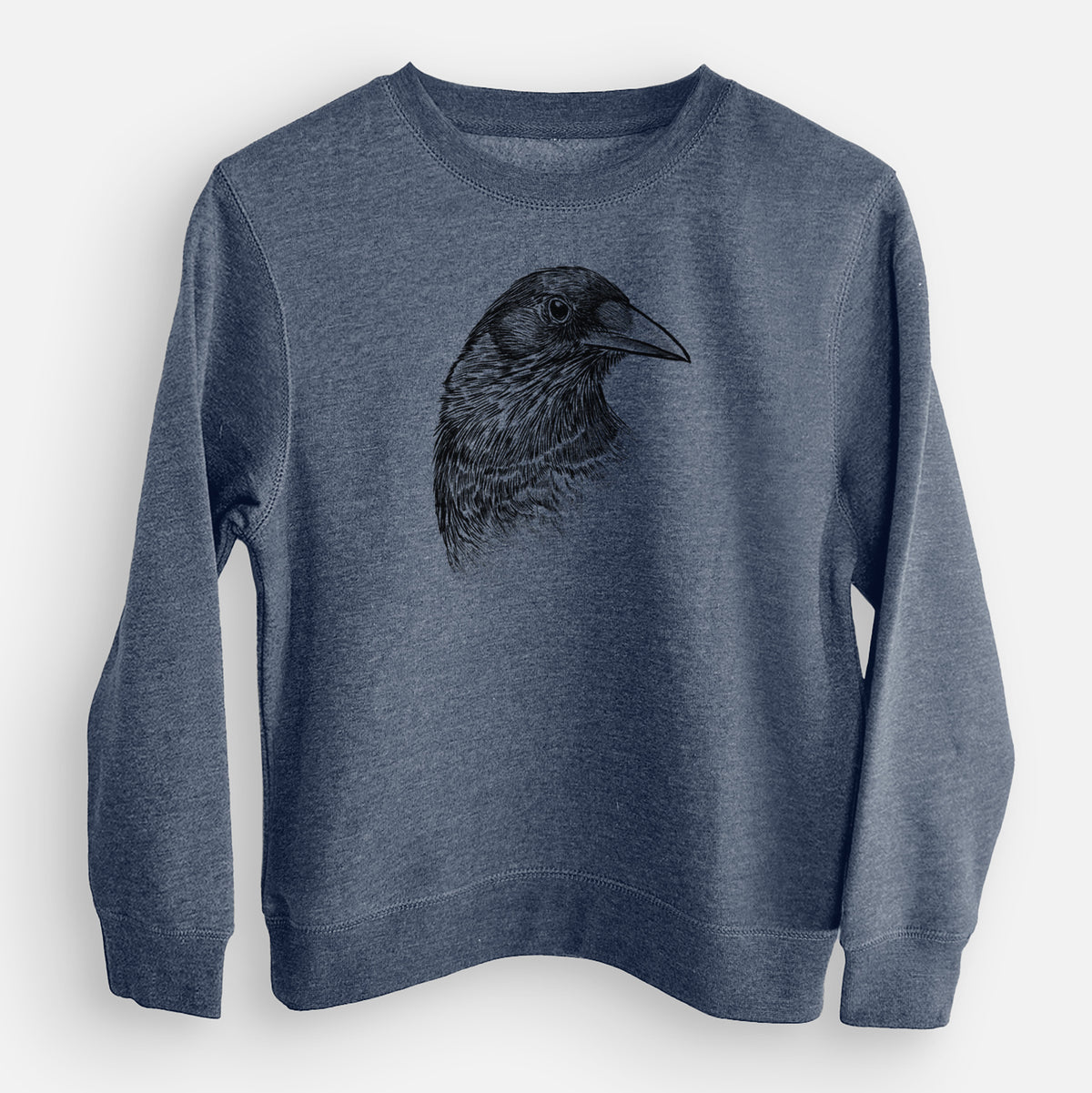 Storm blue youth crewneck sweatshirt laid flat, printed with a detailed black ink portrait of a crow's head in profile.