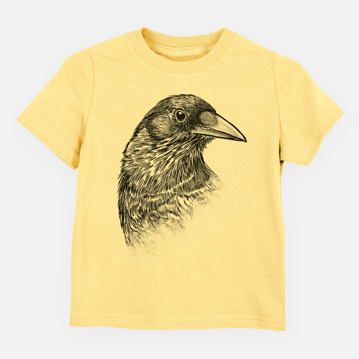 Butter yellow toddler t-shirt laid flat, printed with a detailed black ink portrait of a crow's head in profile.