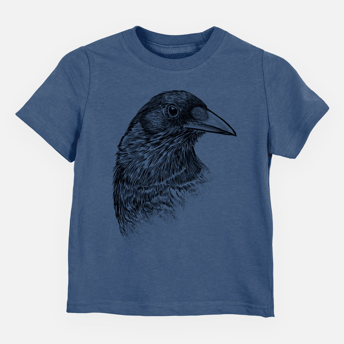 Indigo blue toddler t-shirt laid flat, printed with a detailed black ink portrait of a crow's head in profile.