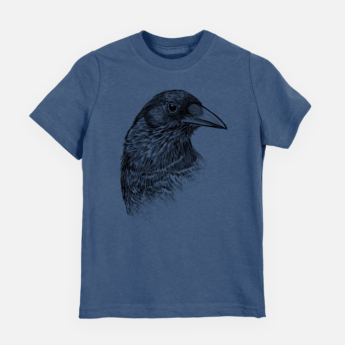 Indigo blue youth t-shirt laid flat, printed with a detailed black ink portrait of a crow's head in profile.