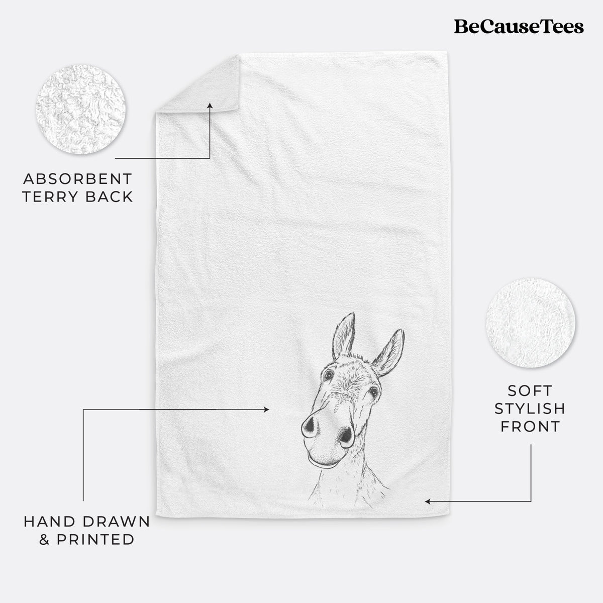 White hand towel printed with a black ink illustration of a curious donkey's head with tall ears.
