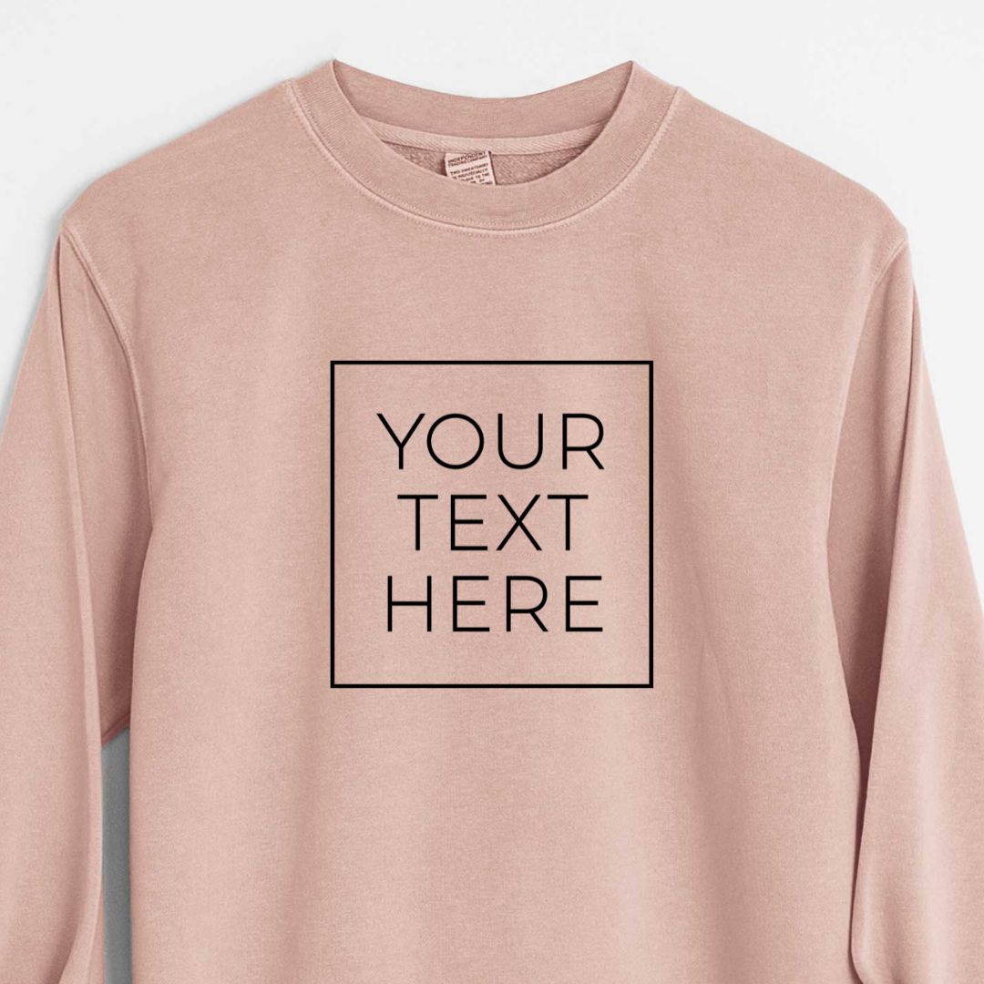 Dusty pink pigment dyed crewneck sweatshirt printed with your own custom text in black letters inside a square outline.