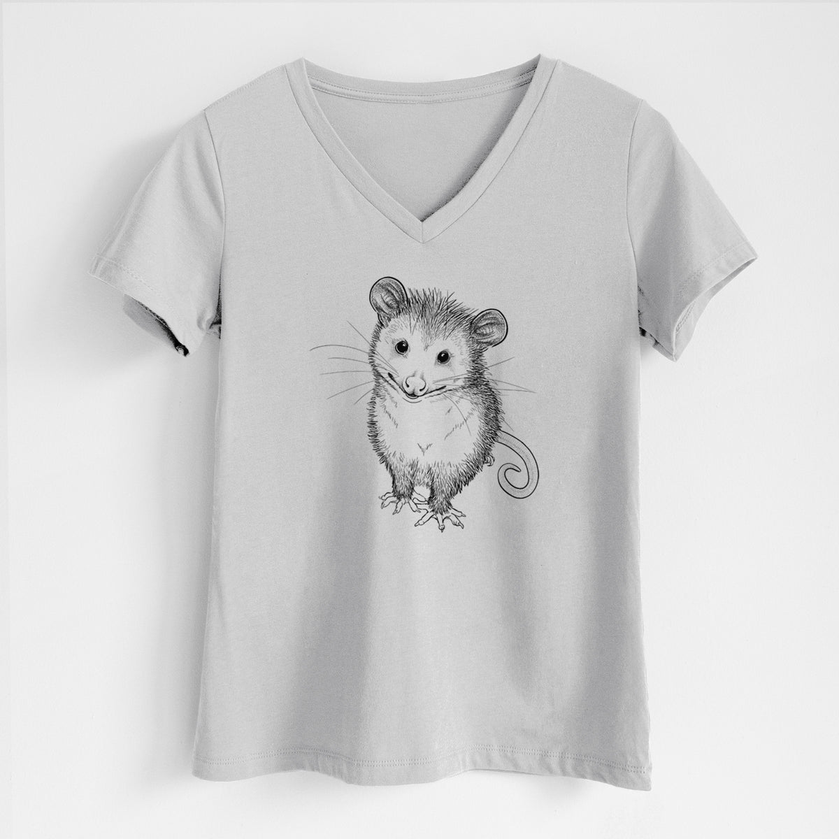 Lunar grey women's relaxed fit cotton V-neck t-shirt laid flat, printed with a black ink illustration of a wide-eyed baby opossum sitting.