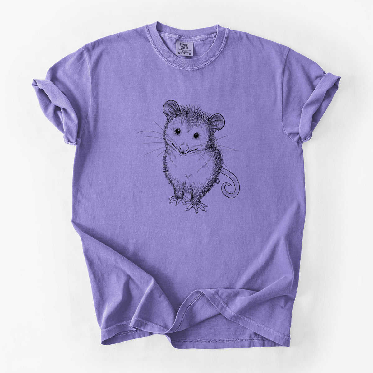 Violet purple Comfort Colors t-shirt laid flat, printed with a black ink illustration of a wide-eyed baby opossum sitting.