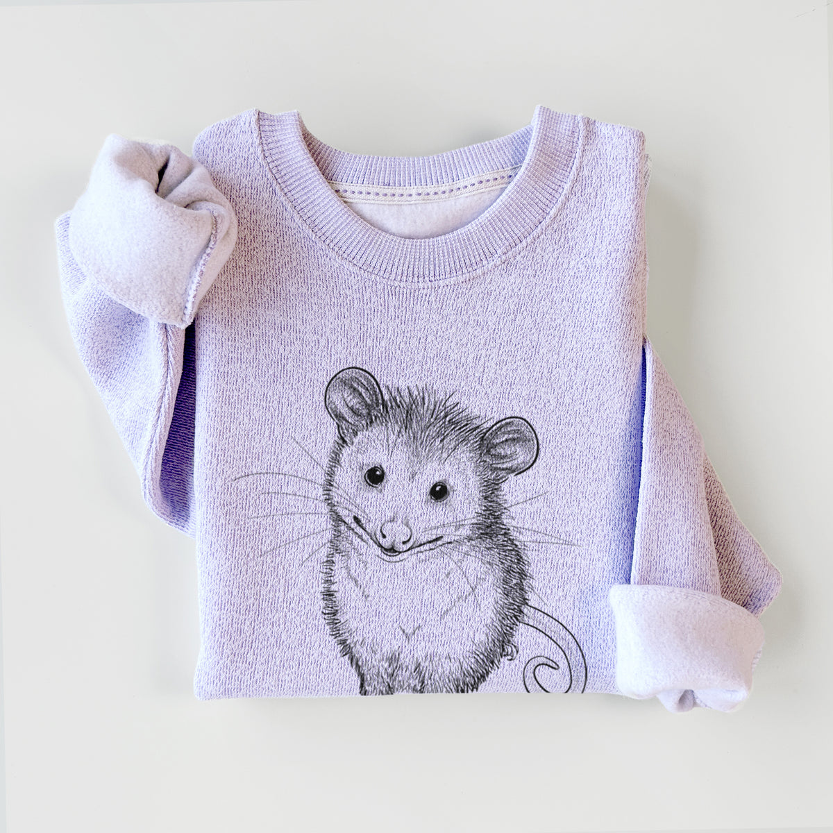 Ice purple knit sweatshirt printed with a black ink illustration of a wide-eyed baby opossum sitting, styled flat.