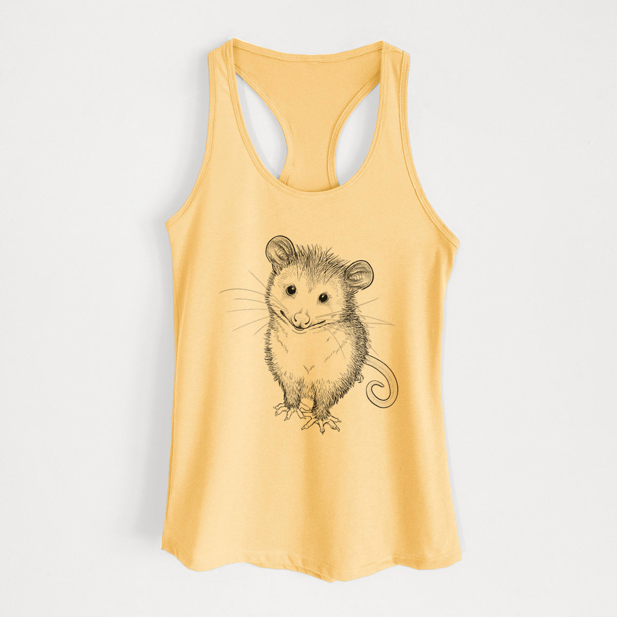 Banana cream women's racerback tank top laid flat, printed with a black ink illustration of a wide-eyed baby opossum sitting.