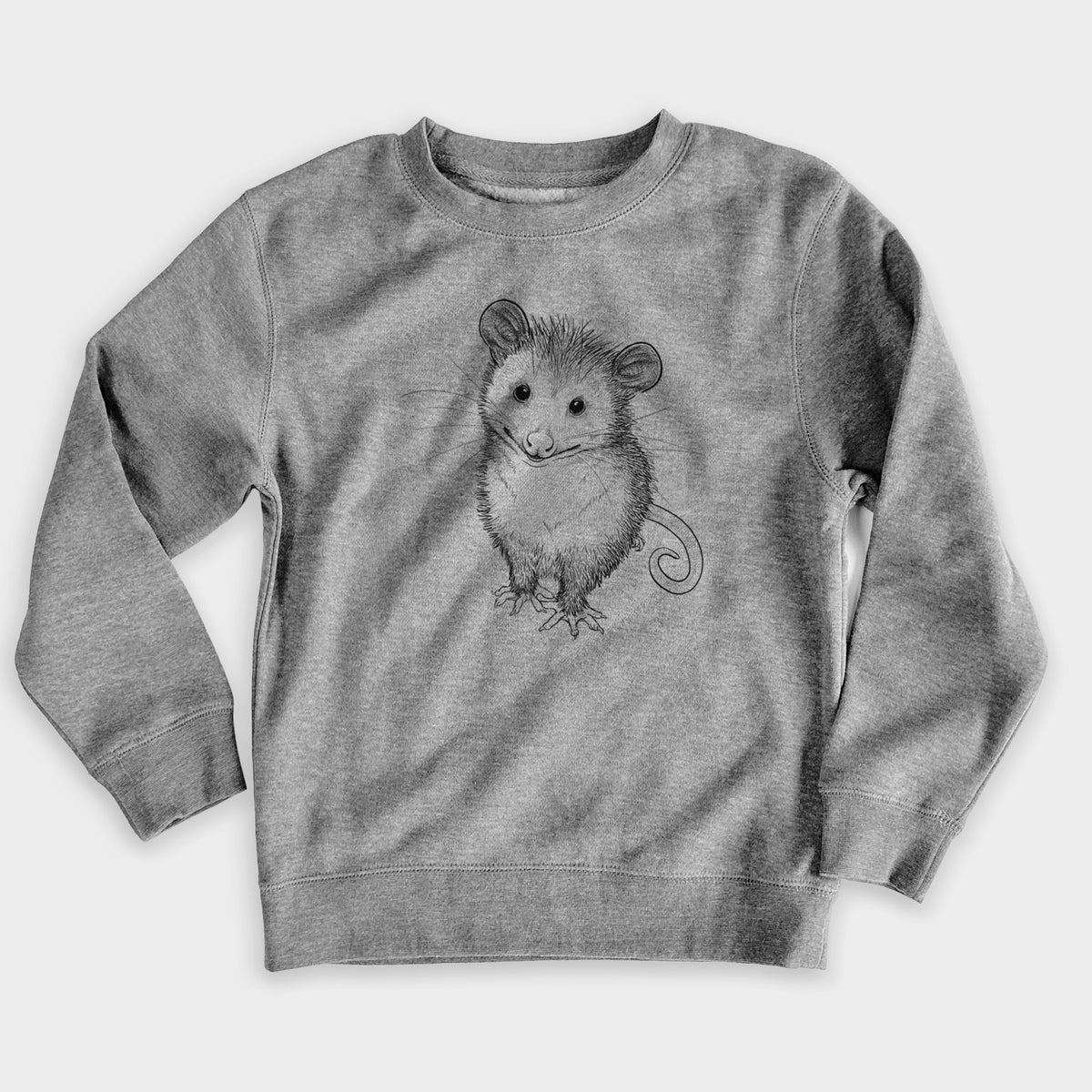 Nickel grey youth crewneck sweatshirt laid flat, printed with a black ink illustration of a wide-eyed baby opossum sitting.