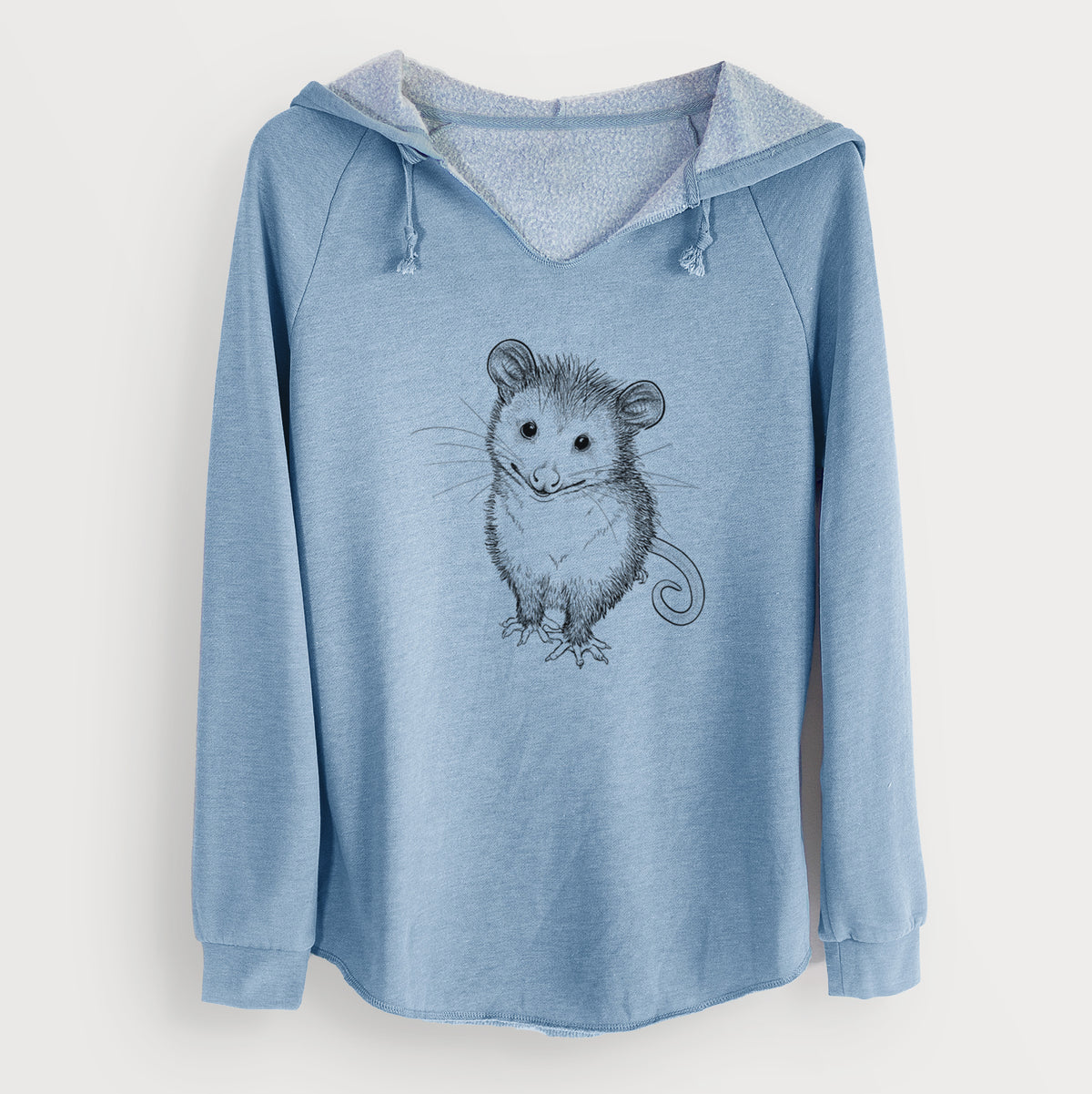 Misty blue women's Cali Wave hooded sweatshirt laid flat, printed with a black ink illustration of a wide-eyed baby opossum sitting.