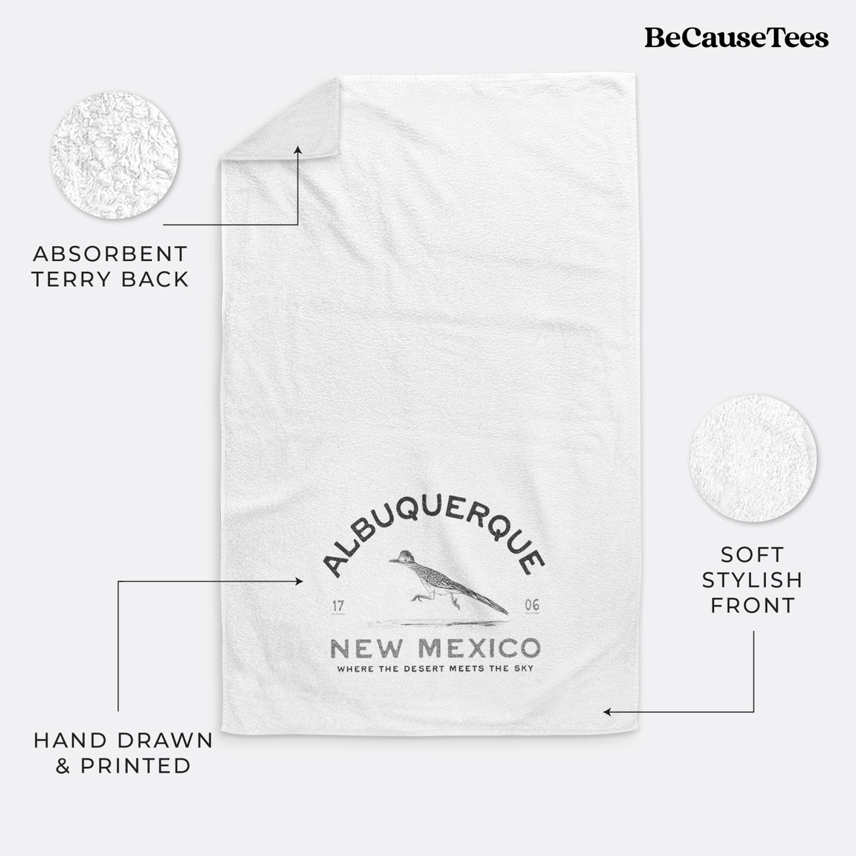 White hand towel printed with a black ink roadrunner with the words Albuquerque New Mexico, 1706, Where the Desert Meets the Sky.