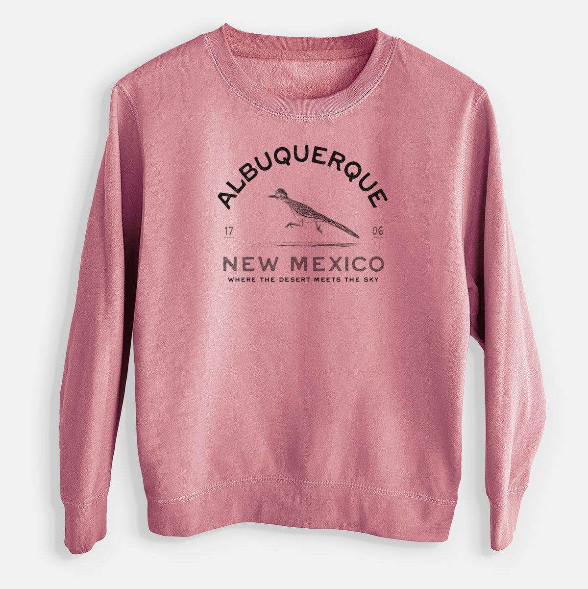 Mauve pink youth crewneck sweatshirt laid flat, printed with a black ink roadrunner with the words Albuquerque New Mexico, 1706, Where the Desert Meets the Sky.