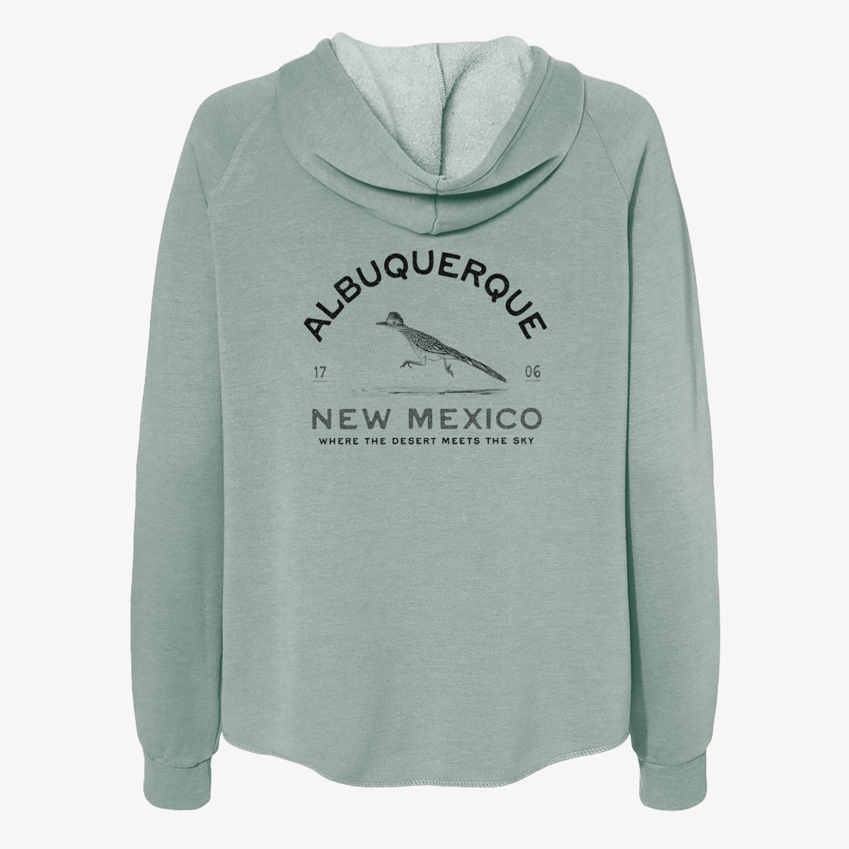 Sage green women's Cali Wave zip-up sweatshirt laid flat, printed with a black ink roadrunner with the words Albuquerque New Mexico, 1706, Where the Desert Meets the Sky.