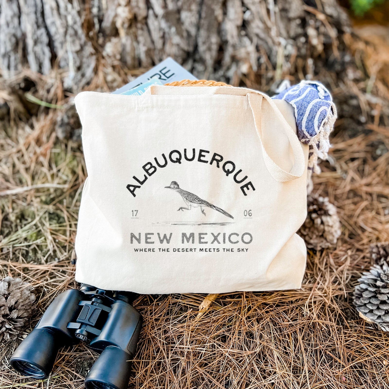 Natural canvas tote bag printed with a black ink roadrunner with the words Albuquerque New Mexico, 1706, Where the Desert Meets the Sky.
